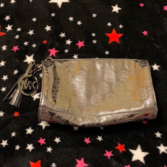 Michael Kors Handbags - Michael Kors silver metallic pouch Michael Kors Handbags - Michael Kors silver metallic pouch